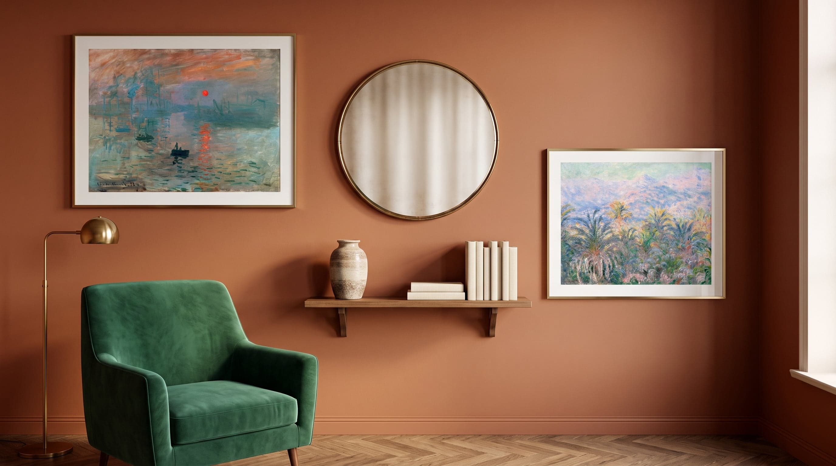 Warm study wall with two landscape art prints, an antique mirror and a shelf with decor.